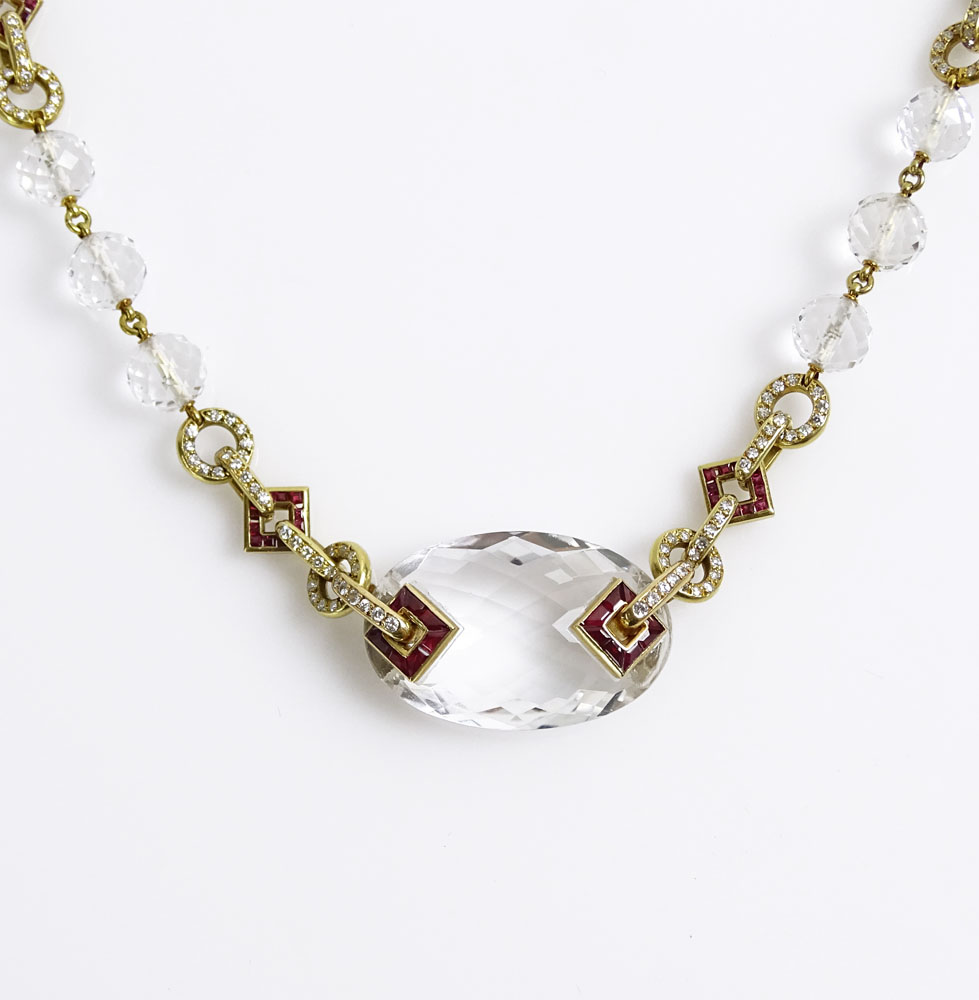 Art Deco Design 18 Karat Yellow Gold Necklace with Carved Rock Crystal Beads Accented throughout with 2.50 Carat Invisible Set Rubies and 4.0 Carat Round Cut Diamonds.