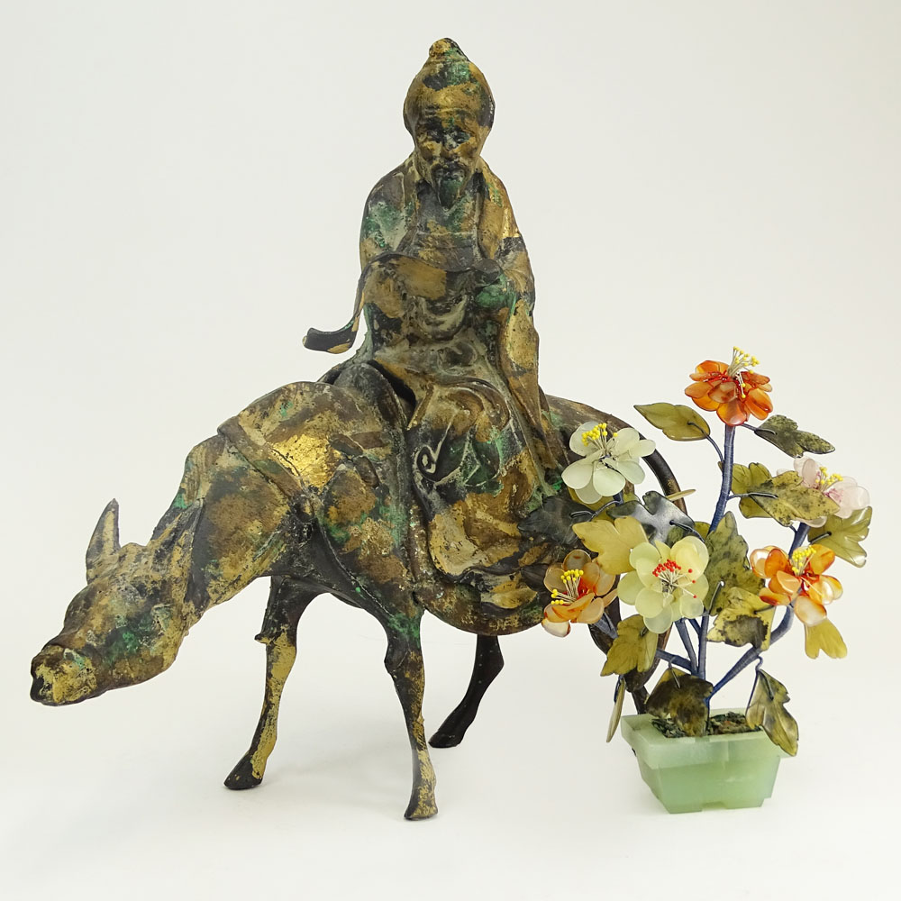 A Chinese Iron Sculpture Depicting a Scholar on a Donkey and a Miniature Ming Tree.