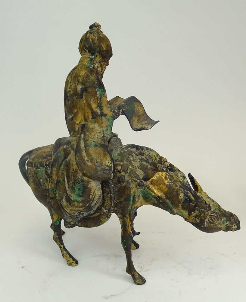 A Chinese Iron Sculpture Depicting a Scholar on a Donkey and a Miniature Ming Tree.