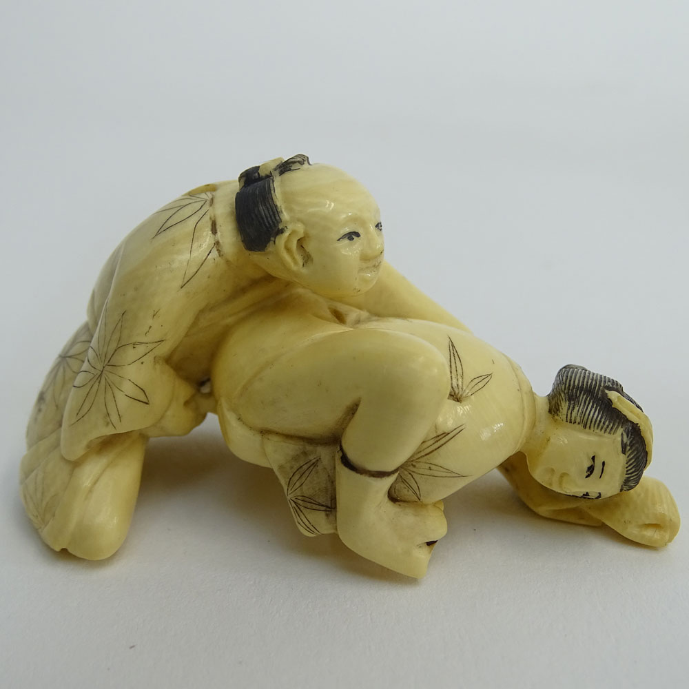 Two (2) Vintage Japanese Carved Ivory Okimono, Seated Man with Bonsai on Wood Base and Water Buffalo and a Japanese Carved Ivory Netsuke Erotic Couple.