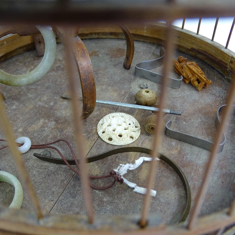 Early 20th Century Chinese Carved Wood Hanging Birdcage with Blue and White Porcelain Feeders, Jade Swings and Carved Ivory Ornaments Together with Attached Cricket Cage.