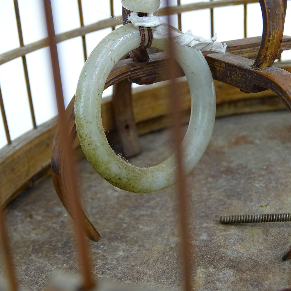 Early 20th Century Chinese Carved Wood Hanging Birdcage with Blue and White Porcelain Feeders, Jade Swings and Carved Ivory Ornaments Together with Attached Cricket Cage.