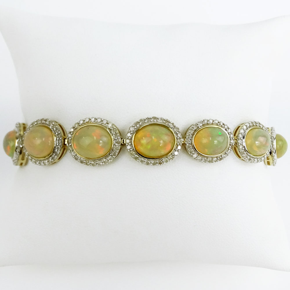 AIG Certified 18.94 Carat Oval Shaped Cabochon Opal, 3.25 Carat Round Brilliant Cut Diamond and 14 Karat Yellow Gold Bracelet.