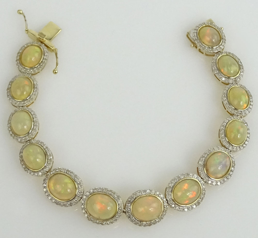 AIG Certified 18.94 Carat Oval Shaped Cabochon Opal, 3.25 Carat Round Brilliant Cut Diamond and 14 Karat Yellow Gold Bracelet.