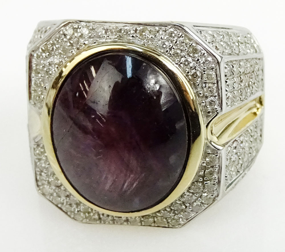 AIG Certified Men's 18.60 Carat Natural Unheated Star Ruby, 1.49 Carat Round Brilliant Cut Diamond and 14 Karat Yellow Gold Ring. 6 to accompany this lot. Shipping $30.00 (estimate $1800-$2500)