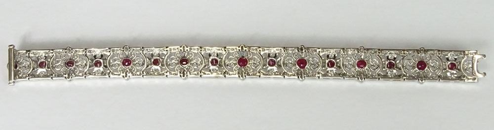 Antique style 18 Karat White Gold Filigree Bracelet Set with Approx. 5.50 Carat Cabochon Rubies and 3.50 Carat Round Brilliant Cut Diamonds.