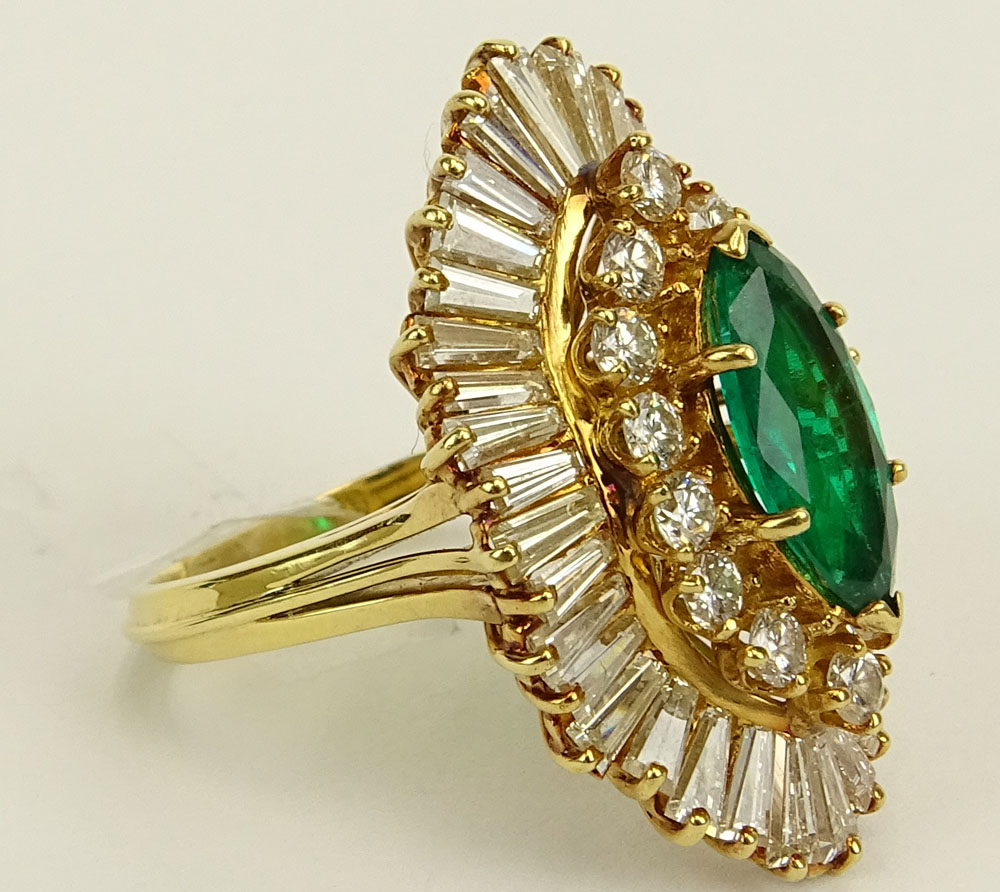 Lady's Approx. 3.75 Carat Colombian Muzo Mine Marquise Cut Emerald, 1.75 Carat Round and Baguette Cut Diamond and 18 Karat Yellow Gold Ballerina Ring. 