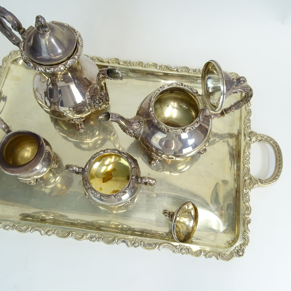 Four (4) Piece Sterling Silver Tea Set on Silver Plate Tray. Includes coffee pot, tea pot, creamer and sugar bowl. 