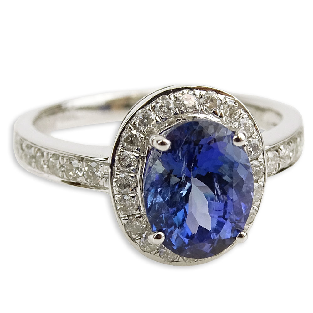 AIG Certified 2.14 Carat Oval Cut Tanzanite, .46 Carat Round Brilliant Cut Diamond and 14 Karat White Gold Ring