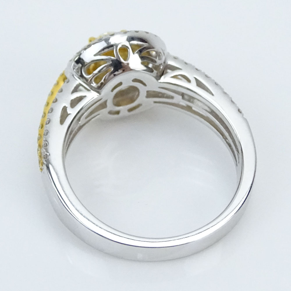 Approx. .80 Carat Fancy Yellow Diamond, .30 Carat Round Cut Diamond and 18 Karat White Gold Ring