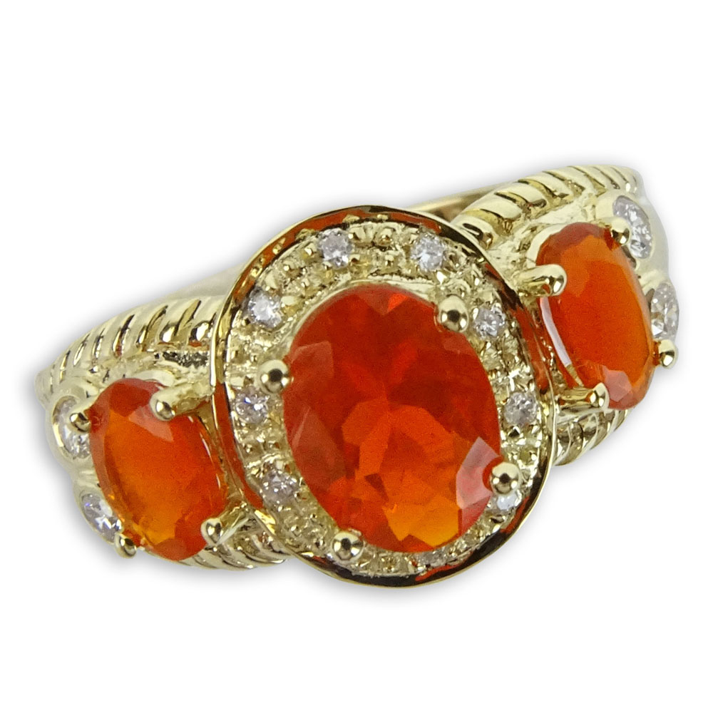 Approx. 1.37 Carat Fire Opal, .75 Carat Round Cut Diamond and 14 Karat Yellow Gold Three Stone Ring