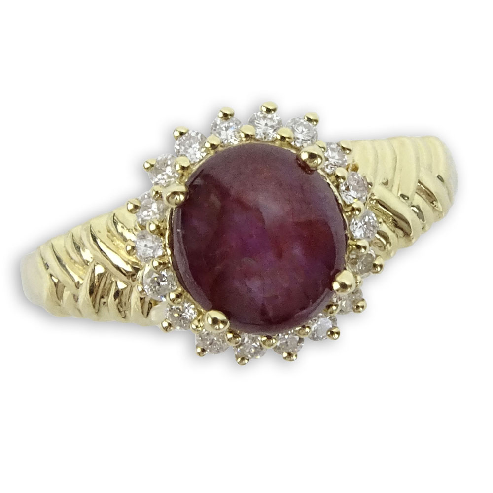 2.73 Carat Star Ruby and 14 Karat Yellow Gold Ring accented with Round Cut Diamonds