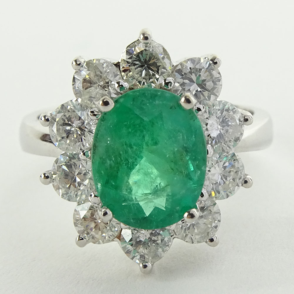 Lady's 2.40 Carat Oval Cut Emerald, 2.15 Carat Round Cut Diamond and 14 Karat White Gold Ring