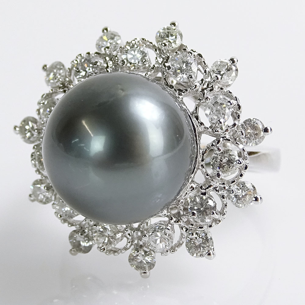 AIG Certified Tahitian Black Pearl, 1.18 Carat Round Brilliant Cut Diamond and 14 Karat White Gold Ring. 