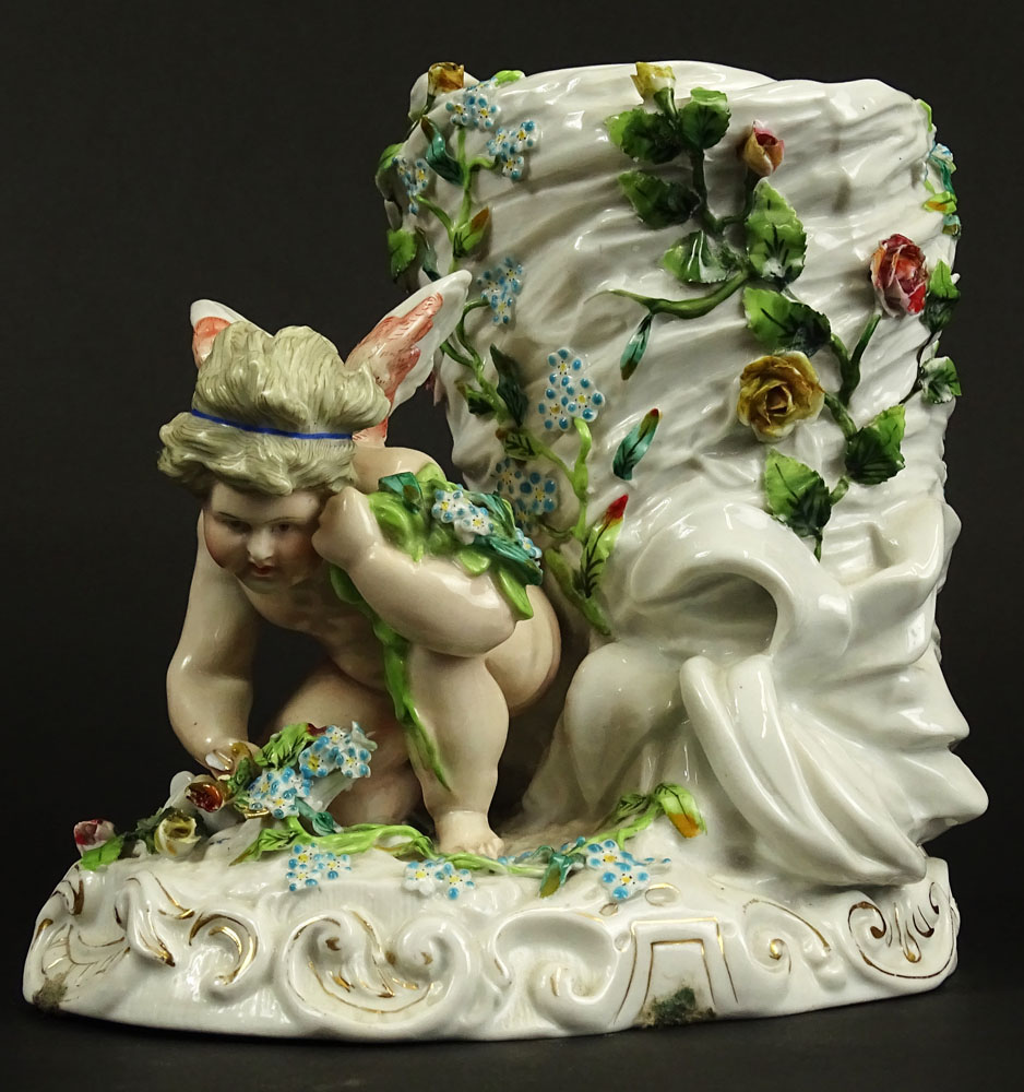 Antique Continental Meissen Style Porcelain Figural Vase. Decorated with Cherub and Flowers