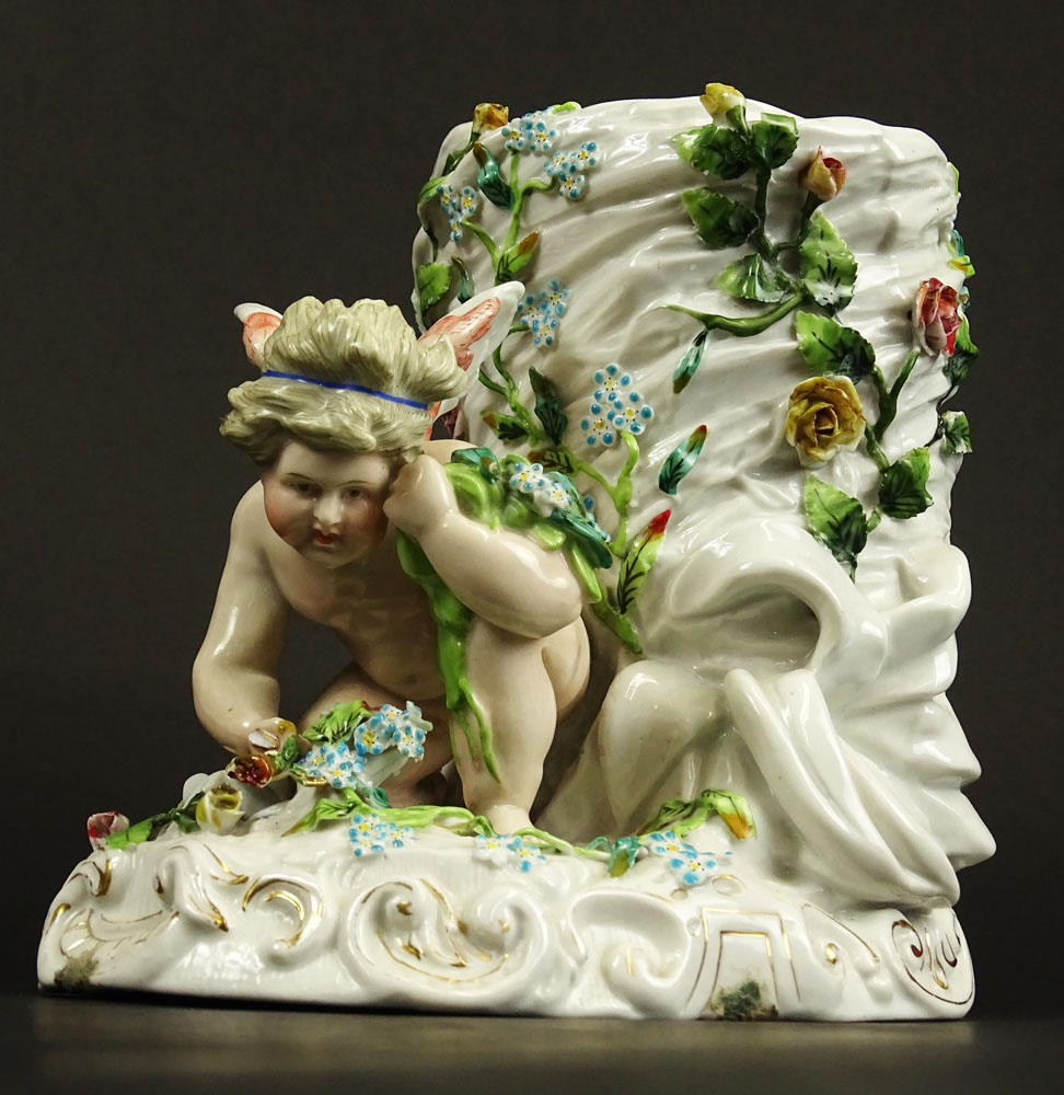 Antique Continental Meissen Style Porcelain Figural Vase. Decorated with Cherub and Flowers