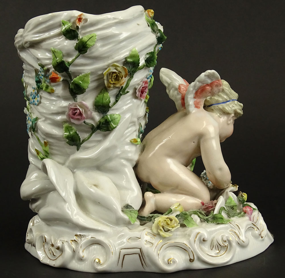 Antique Continental Meissen Style Porcelain Figural Vase. Decorated with Cherub and Flowers