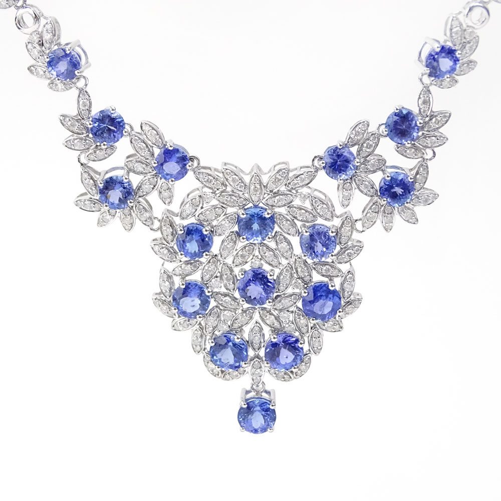 AIG Certified 33.83 Carat Mixed Cut Tanzanite, 4.43 Carat Round Brilliant Cut Diamond and 14 Karat White Gold Necklace.