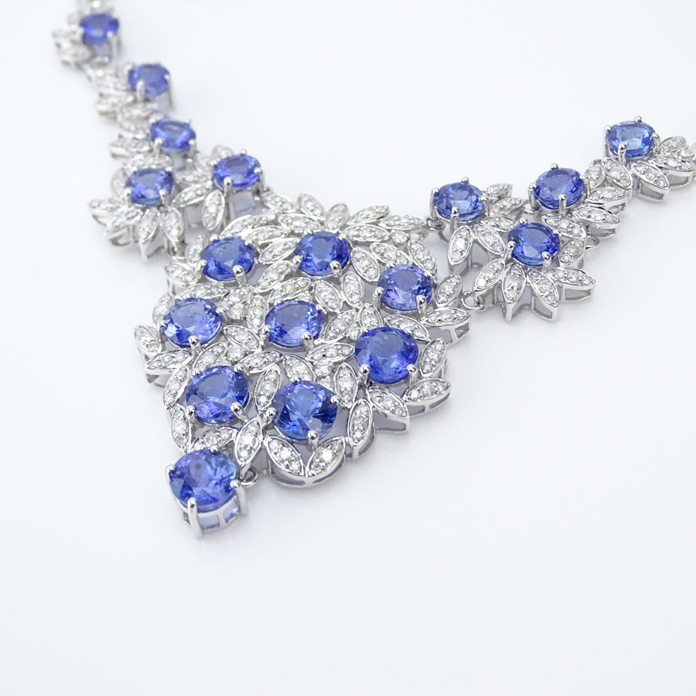 AIG Certified 33.83 Carat Mixed Cut Tanzanite, 4.43 Carat Round Brilliant Cut Diamond and 14 Karat White Gold Necklace.