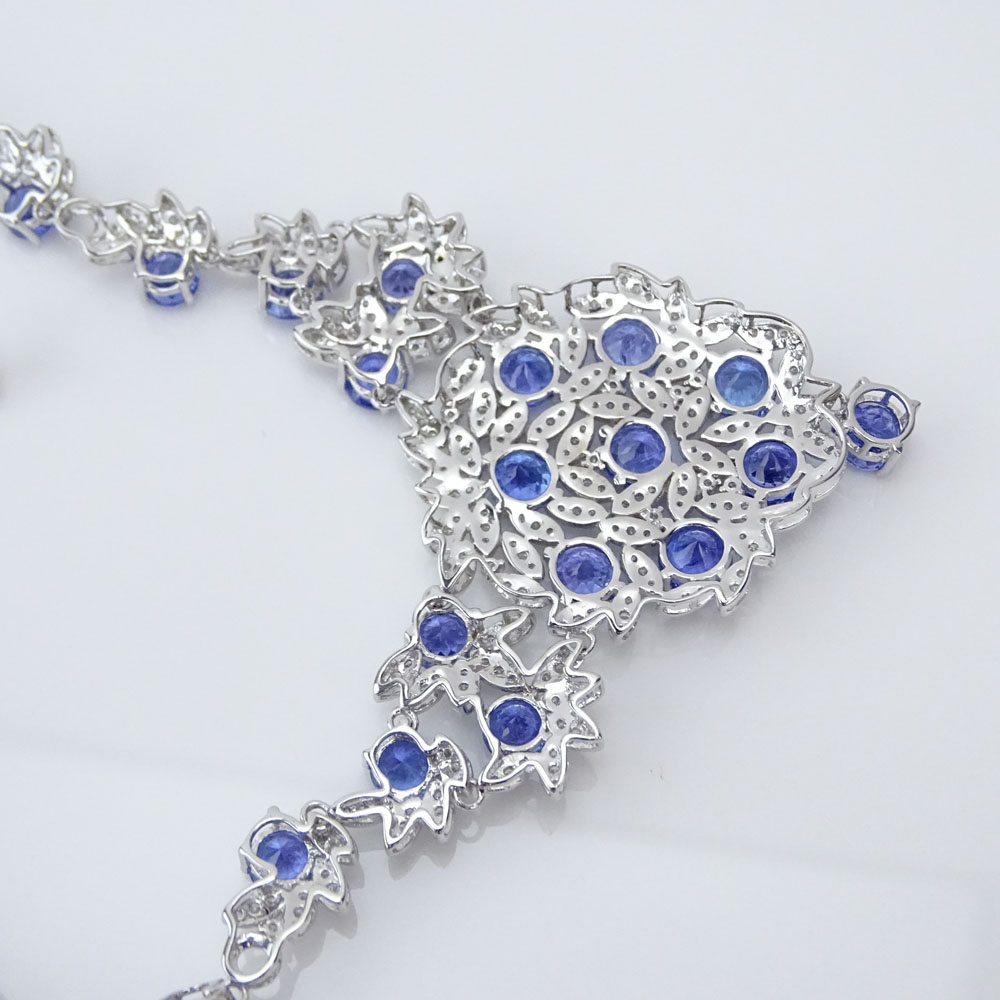 AIG Certified 33.83 Carat Mixed Cut Tanzanite, 4.43 Carat Round Brilliant Cut Diamond and 14 Karat White Gold Necklace.