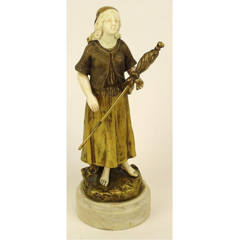 Theophile Francois Somme, French (1871-1952) Gilt bronze and ivory figure on marble base "Girl with Staff and Flag" 