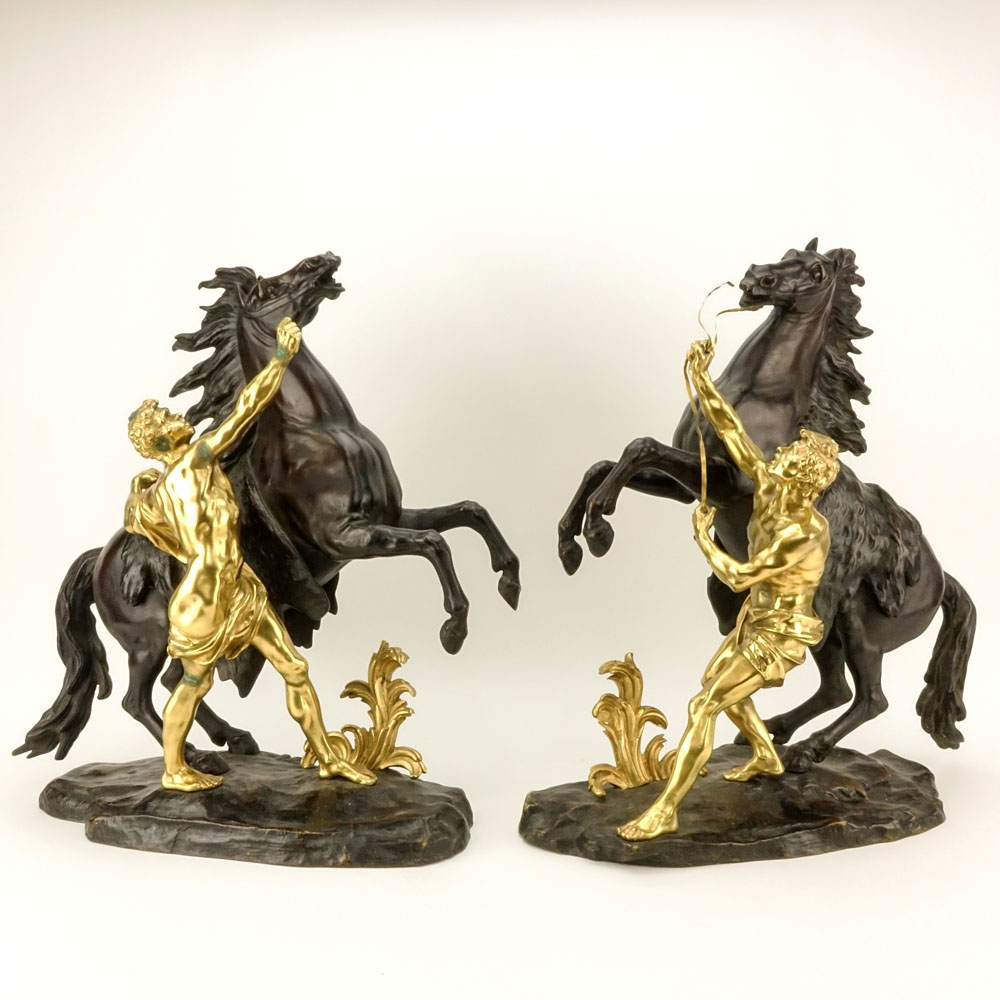 after: Guillaume Coustou the Younger, French (1716-1777) Pair of Patinated and Gilt Bronze Marly Horses. 