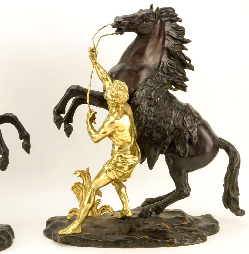 after: Guillaume Coustou the Younger, French (1716-1777) Pair of Patinated and Gilt Bronze Marly Horses. 