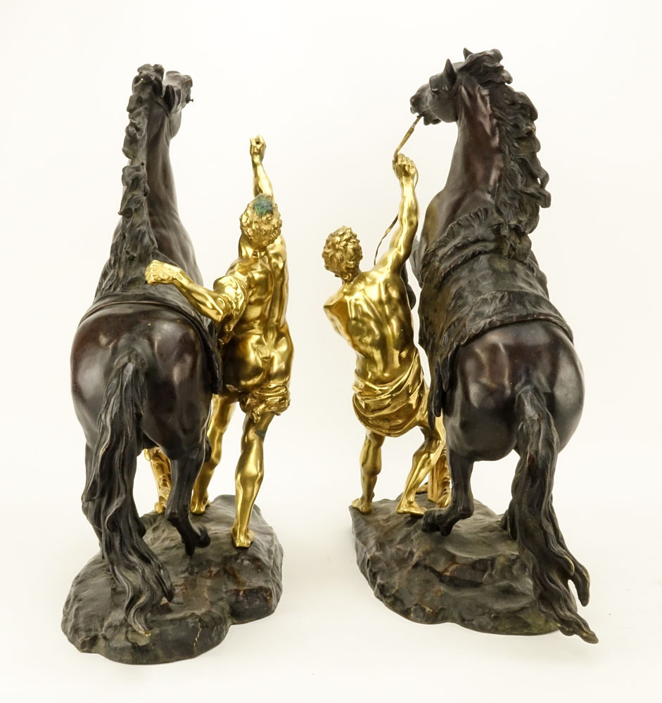 after: Guillaume Coustou the Younger, French (1716-1777) Pair of Patinated and Gilt Bronze Marly Horses. 