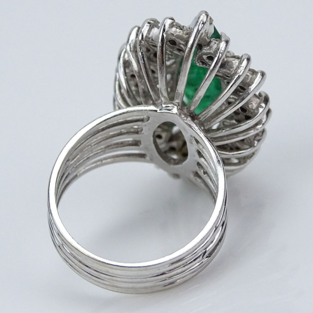 Vintage Marquise Cut Emerald, Round Cut Diamond and 14 Karat White Gold Ballerina Ring.