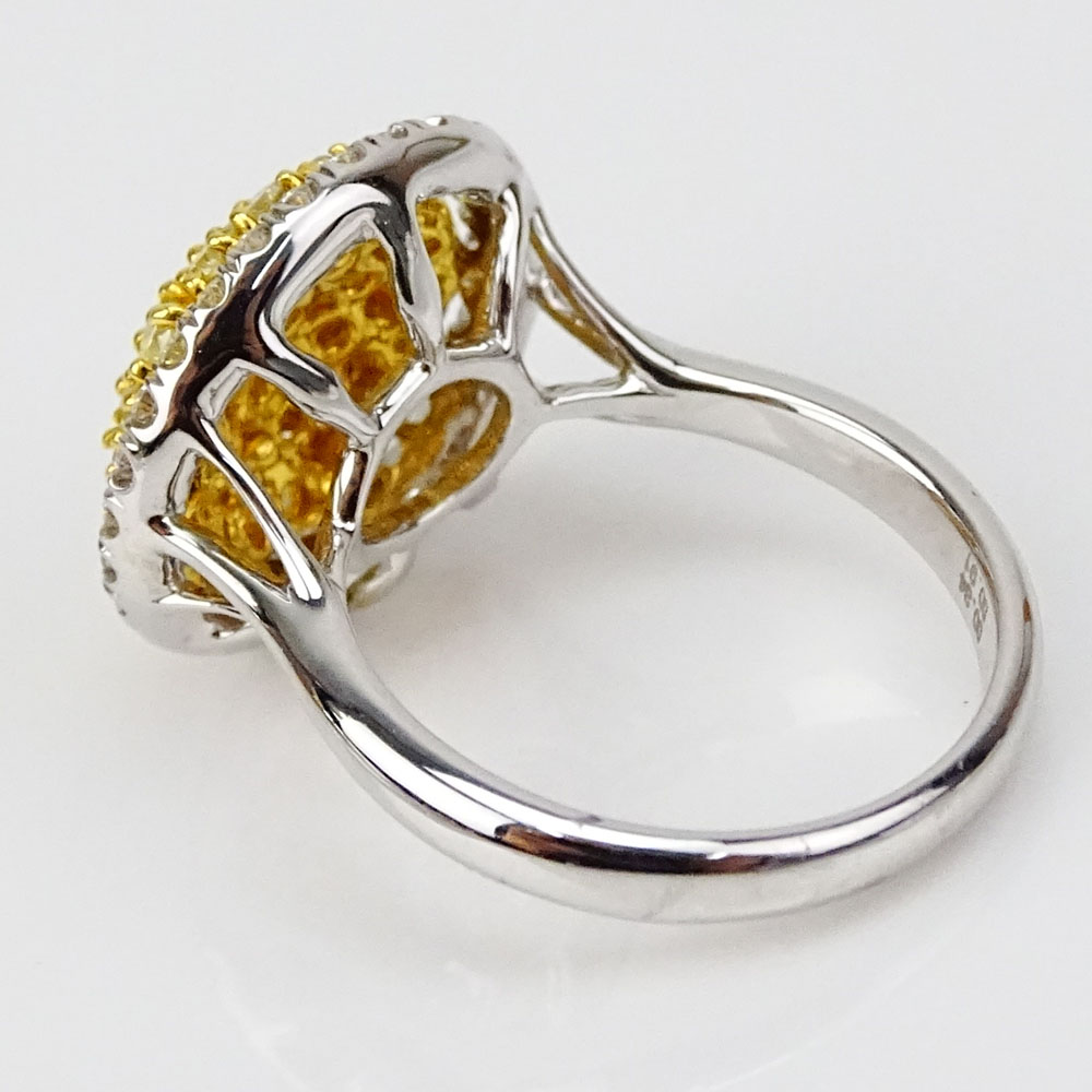 .91 Carat Natural Fancy Yellow Diamond, .35 Carat Round Diamonds and 18 Karat White Gold Dome Ring