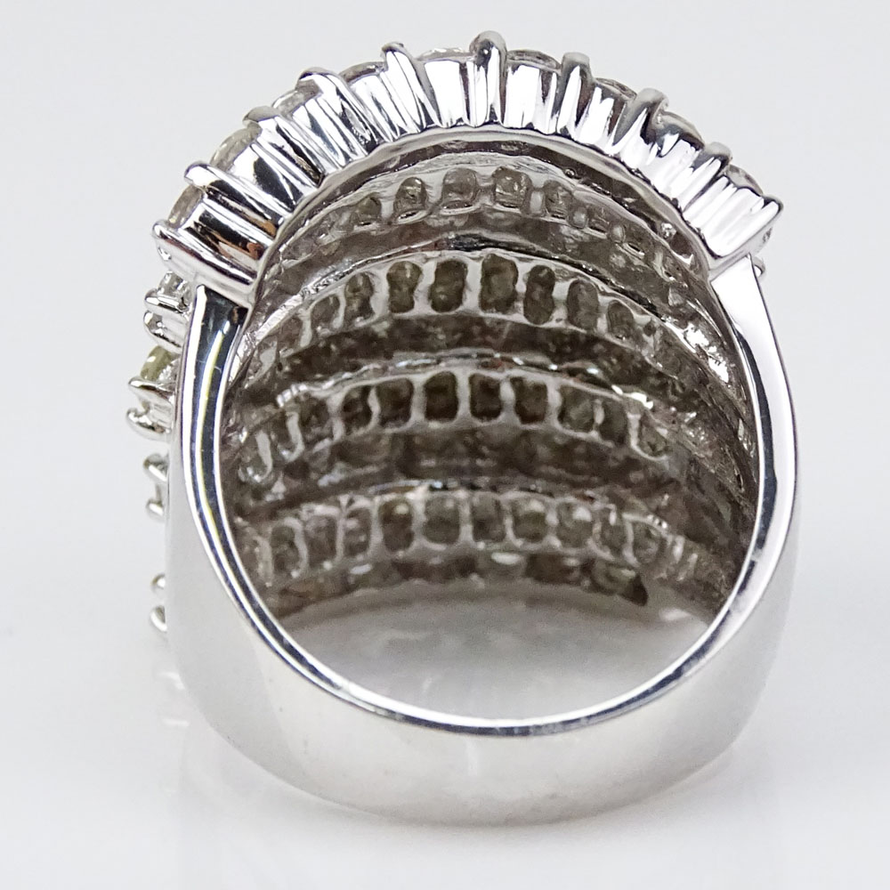5.58 Carat Round Brilliant Cut and Tapered Baguette Diamond and 18 Karat White Gold Ring