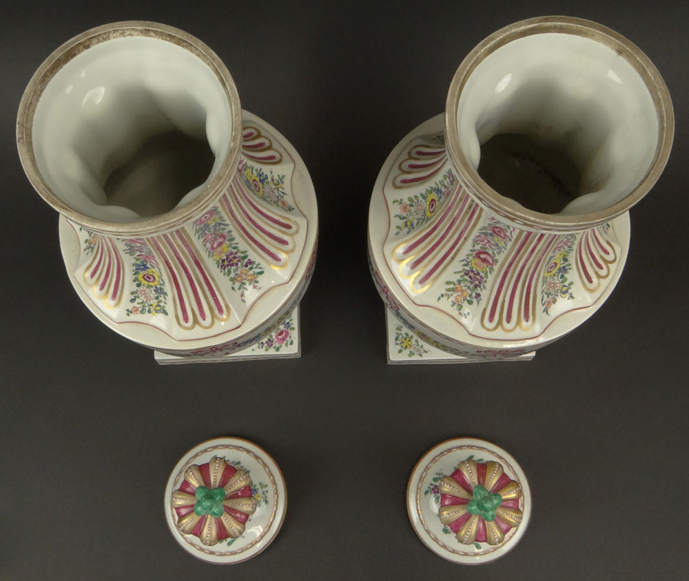 Pair of Early 20th Century French Louis XVI-style Painted Porcelain Urns with Crown Finials.