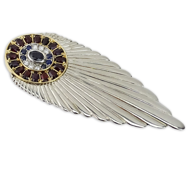 Erte, French (1892-1990) Vintage Diamond, Sapphire, Garnet, 14 Karat Yellow Gold and Sterling Silver "Plume" Brooch