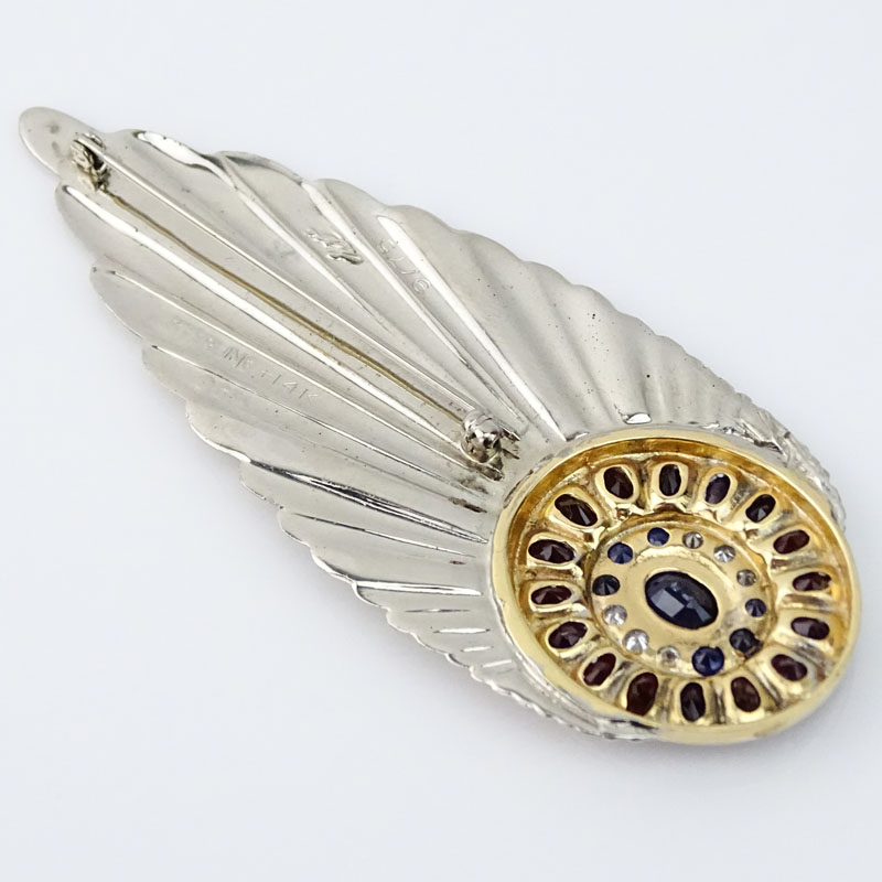 Erte, French (1892-1990) Vintage Diamond, Sapphire, Garnet, 14 Karat Yellow Gold and Sterling Silver "Plume" Brooch