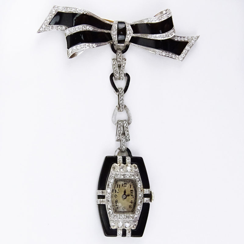 Art Deco Geneva, Swiss No. 3662 Circa 1925 18 Karat White Gold, Diamond and Onyx Lapel Watch.