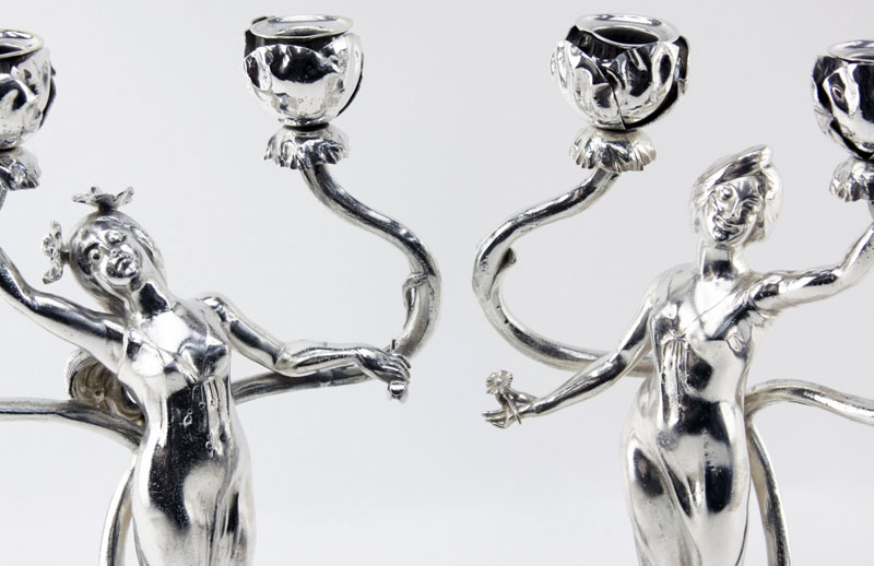 C. Bonnefond, French (19/20th Century) Pair of Art Nouveau Silvered metal figural candelabra.