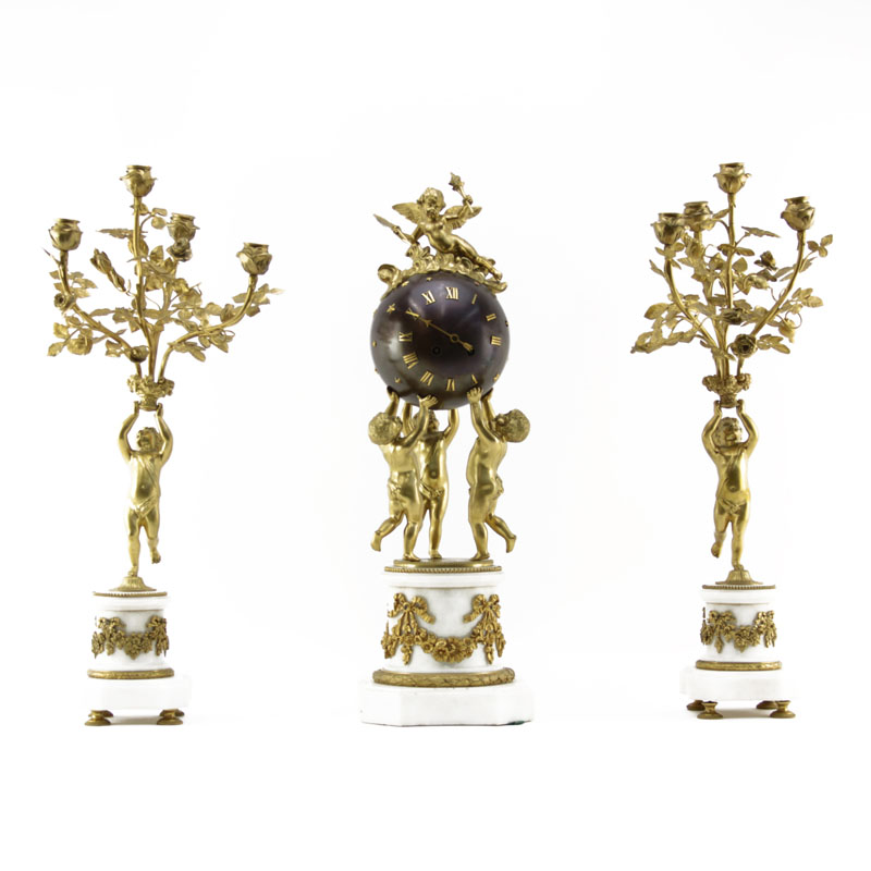 A 19th Century French Louis XVI Style Figural Three Piece Clock Garniture