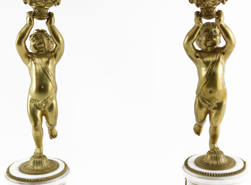 A 19th Century French Louis XVI Style Figural Three Piece Clock Garniture