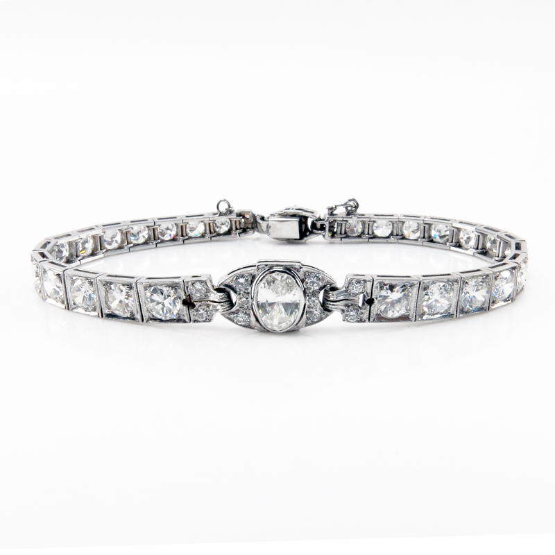 Art Deco Approx. 8.25 Carat Old European Cut Diamond and Platinum Bracelet Set in the Center with an approx. 1.0 Carat Oval Cut Diamond.