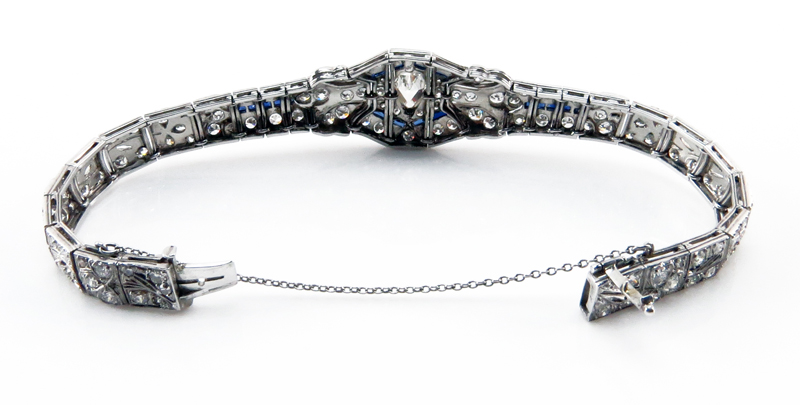 Art Deco Approx. 7.30 Carat TW Diamond, Sapphire and Platinum Belly Bracelet set in the center with a 1.0 carat Shield Shape Diamond 