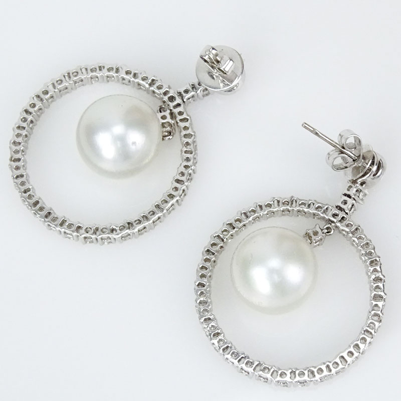 4.27 Carat Round Brilliant Cut Diamond, 13.6mm South Sea Pearl and 18 Karat White Gold Earrings.