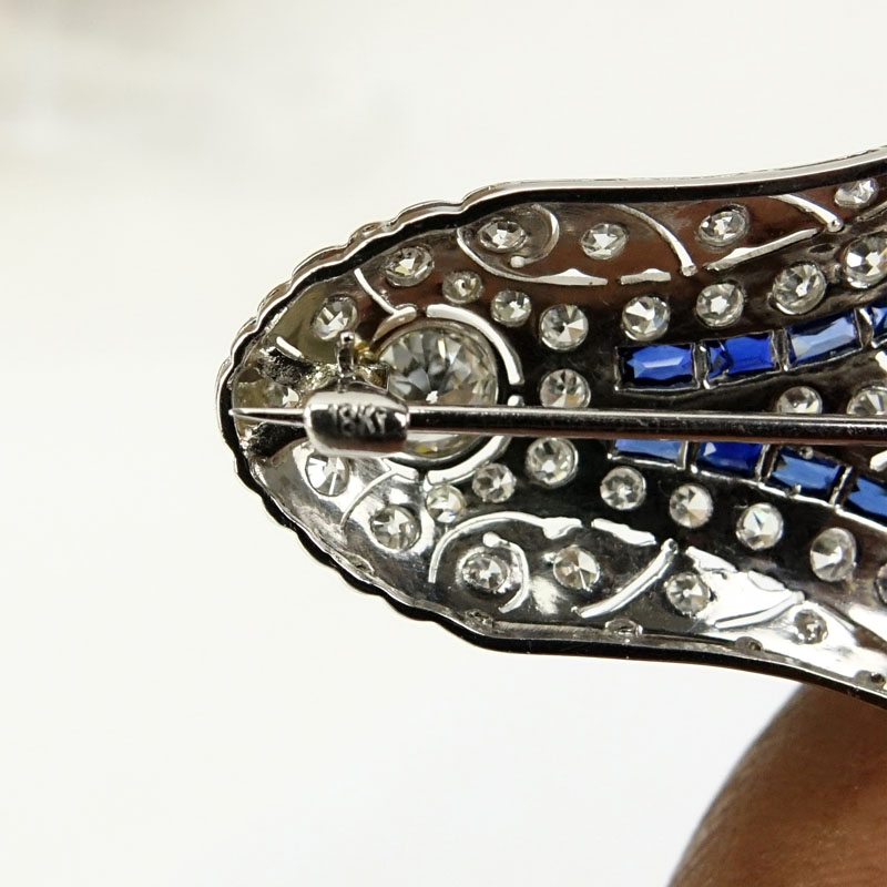 1920s Art Deco Approx. 6.0 Carat TW Round Cut Diamond, 1.0 Carat Caliber Cut Sapphire and Platinum Brooch.