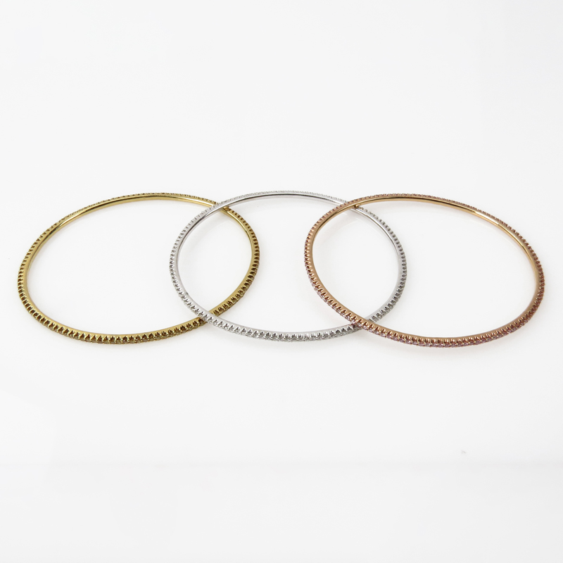 Three Diamond and 18 Karat Gold Bangle Bracelets