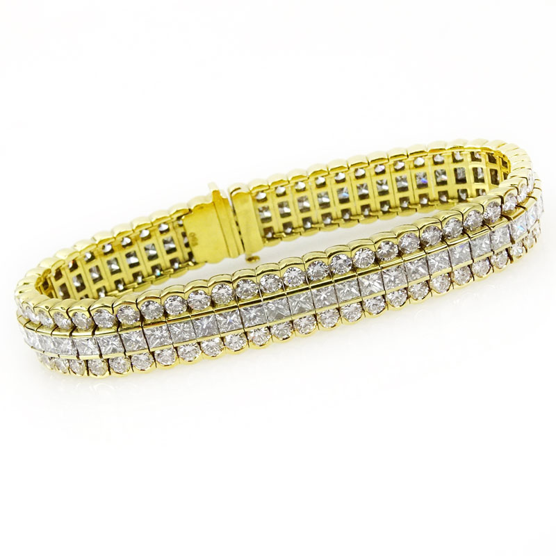 Approx. 25.0 Carat Bezel Set Round Brilliant Cut and Invisible Set Princess Cut Diamond and 18 Karat Yellow Gold Three Row Bracelet