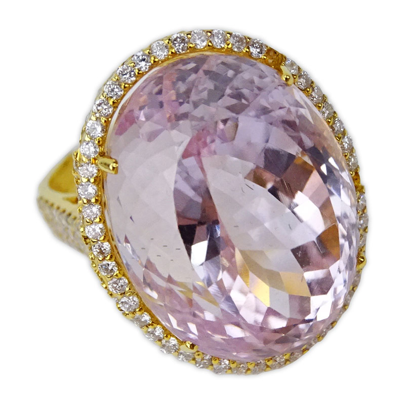 49.12 Carat Oval Cut Kunzite, 2.46 Carat Round Cut Diamond and 18 Karat Rose Gold Ring.