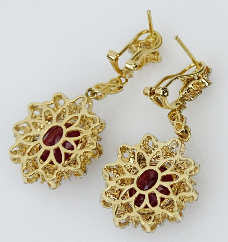 13.74 Carat Oval Cut Ruby, 1.84 Carat Round Cut Diamond and 14 Karat Yellow Gold Earrings. 