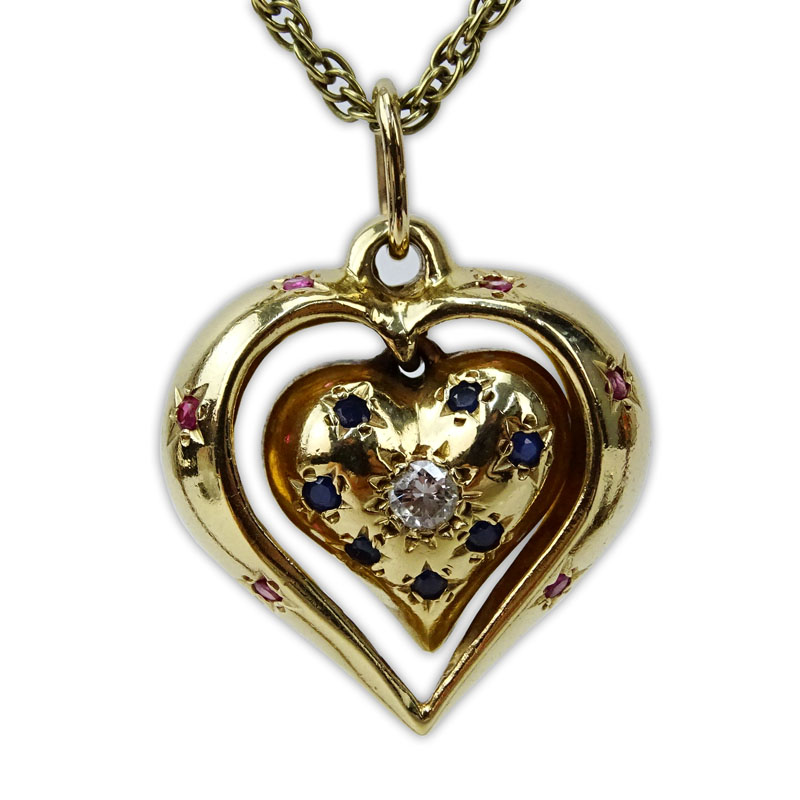 Vintage 14 Karat Yellow Gold Heart Pendant Necklace, the Heart Pendant accented with a Round Brilliant Cut Diamond, Rubies and Sapphires