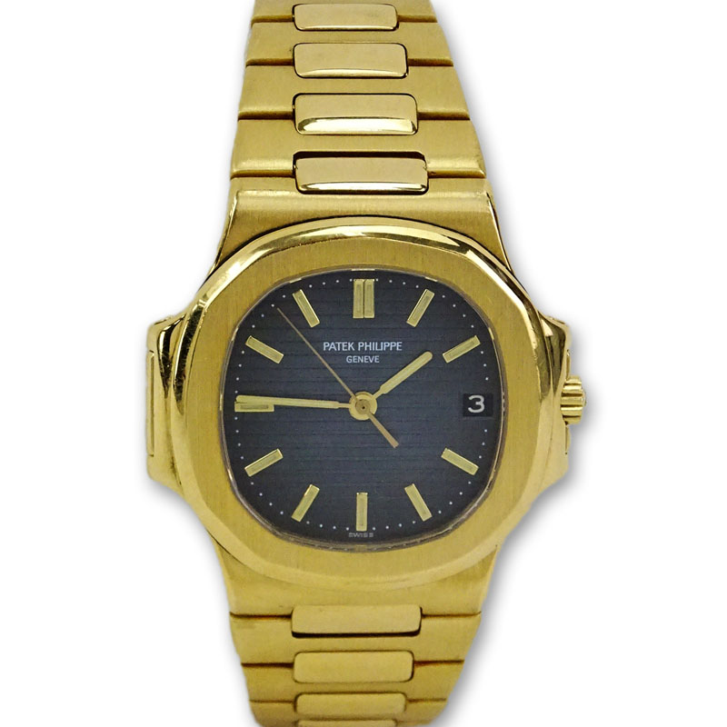 Man's Patek Philippe Nautilus 18 Karat Yellow Gold Automatic Movement Watch with Black Dial