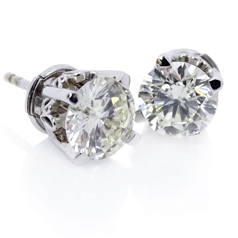 Circa 1950s Approx. 2.25 Carat Round Brilliant Cut Diamond and 14 Karat White Gold Ear Studs.