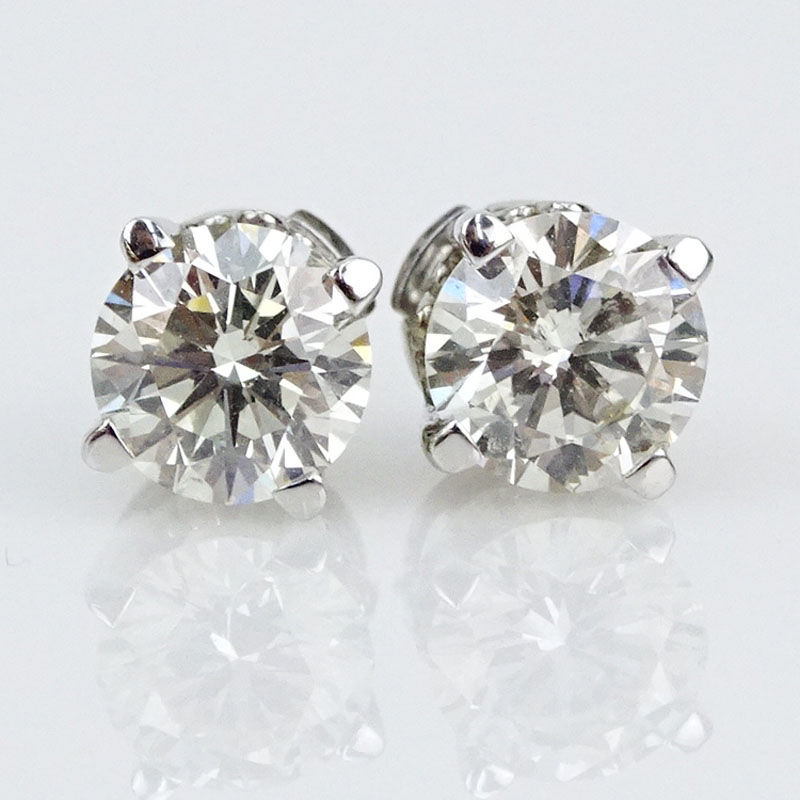 Circa 1950s Approx. 2.25 Carat Round Brilliant Cut Diamond and 14 Karat White Gold Ear Studs.